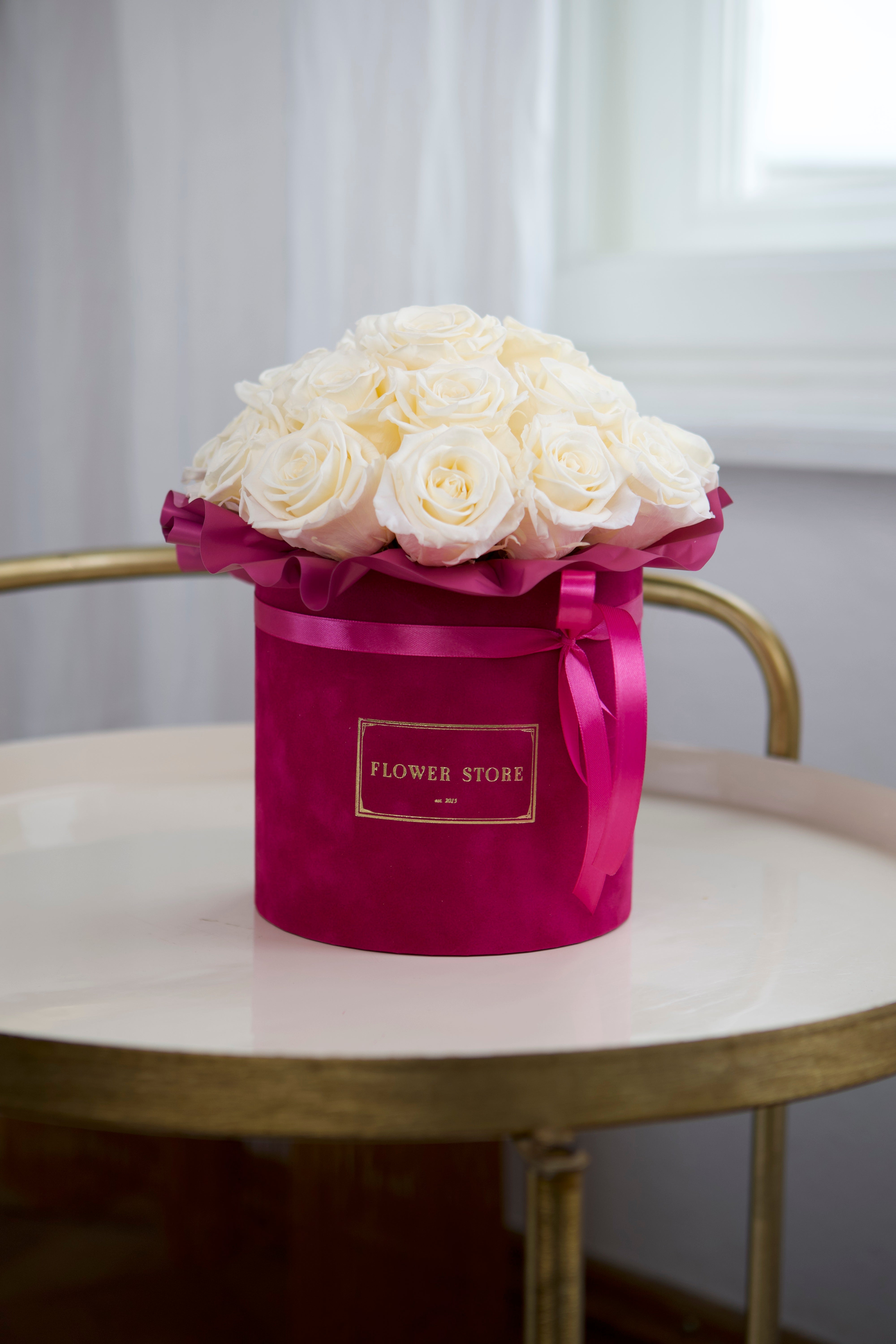 Eternal cream roses in a fuchsia box