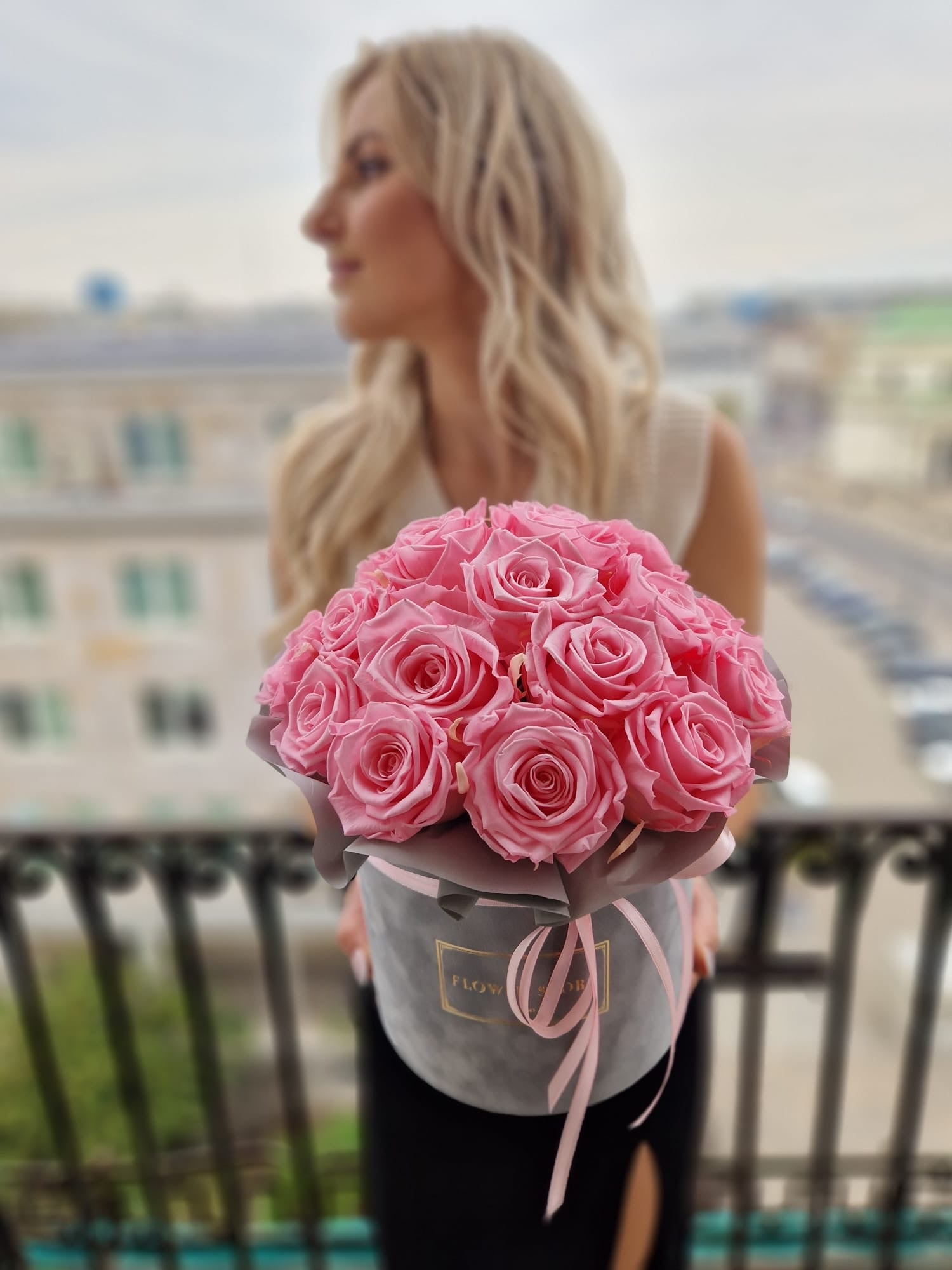 Eternal pink roses in a gray flocked box