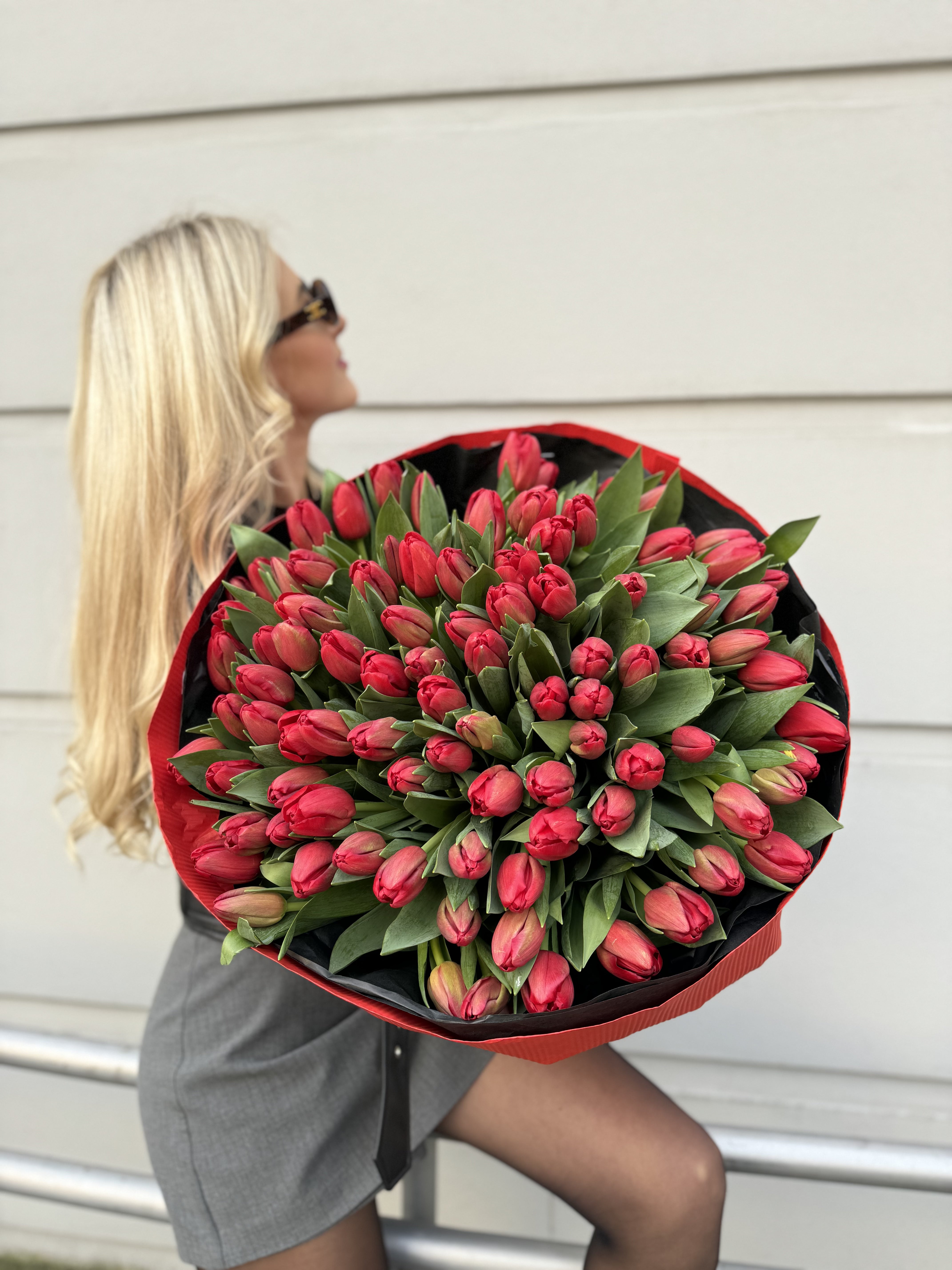 A bouquet of 100 red tulips