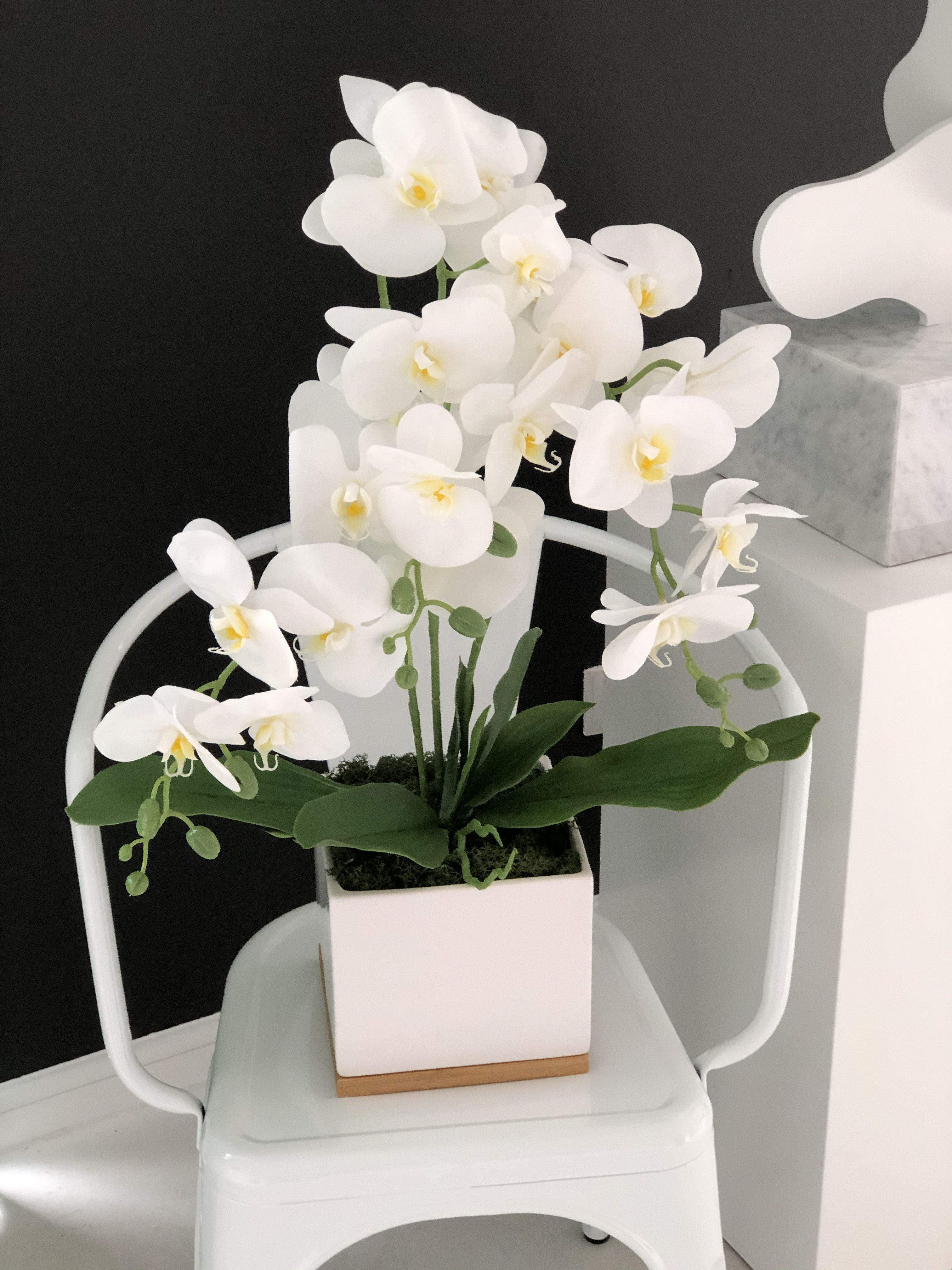 Exclusive artificial orchid in a white pot