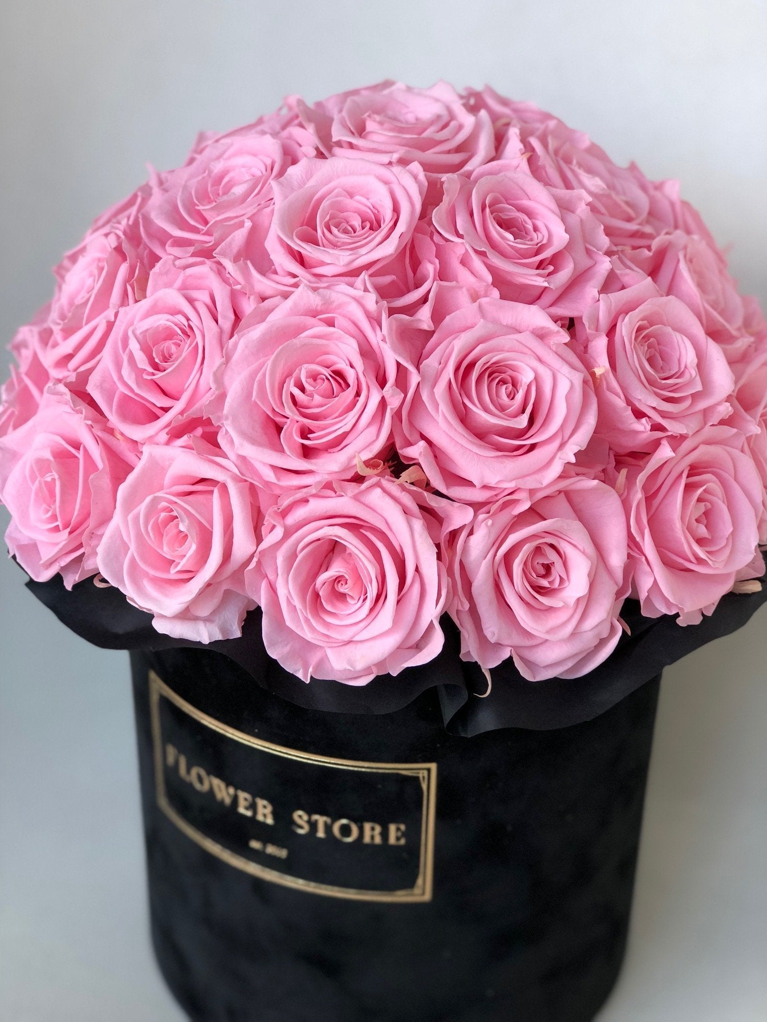 Large black flowerbox with live roses