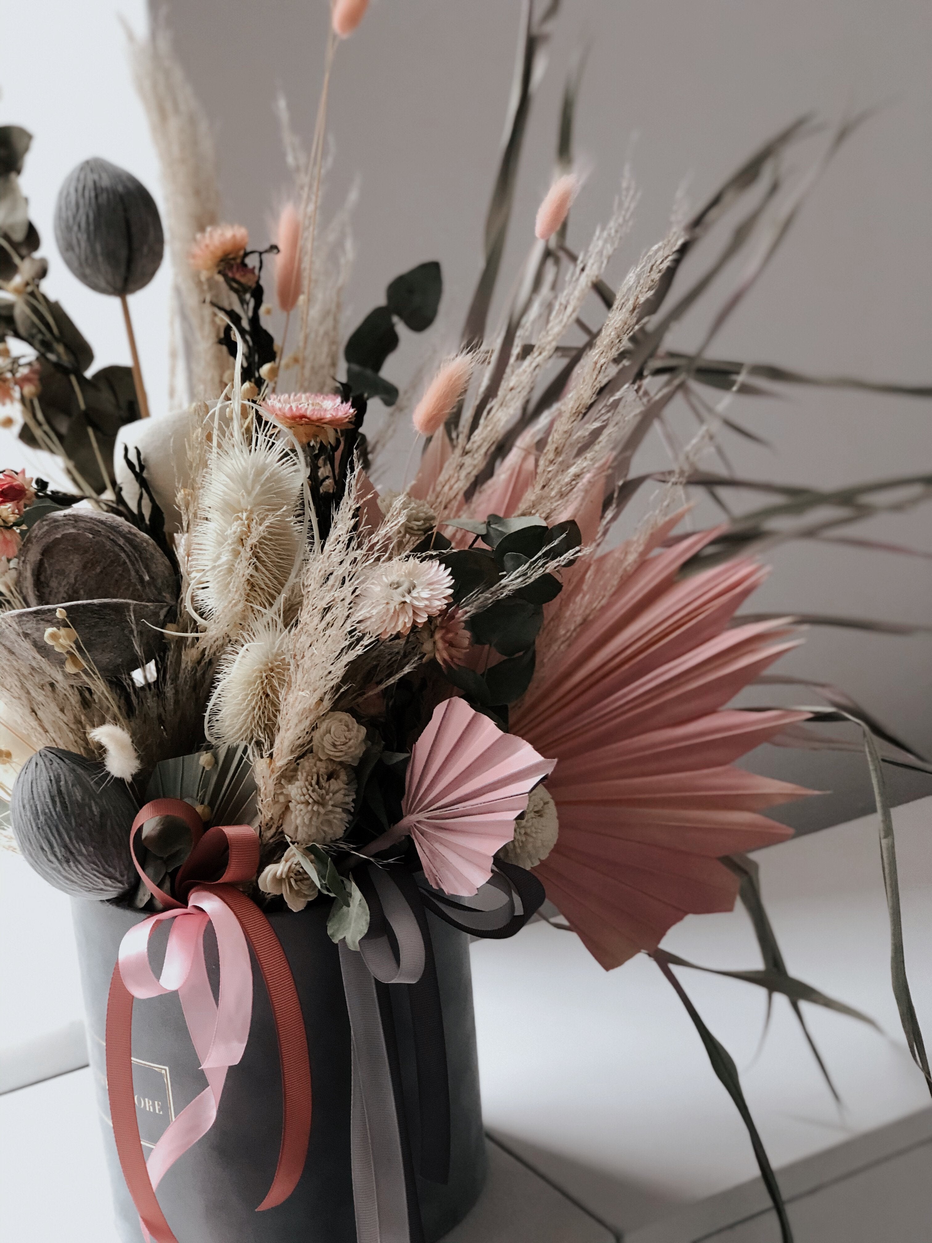 Dried composition with gray flocked Pink flowerbox
