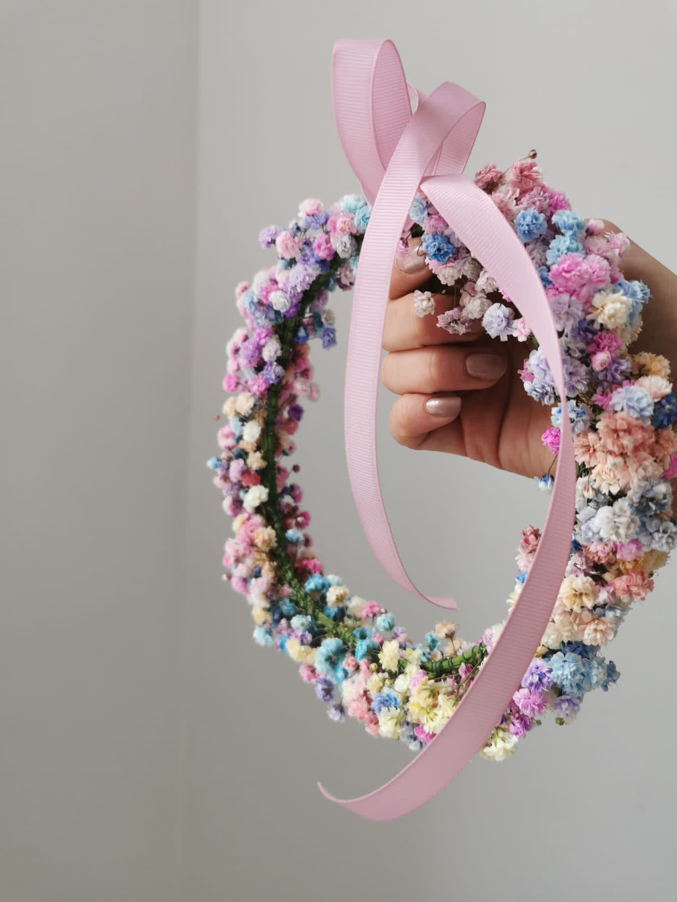 Colorful gypsum wreath on the head - live flowers