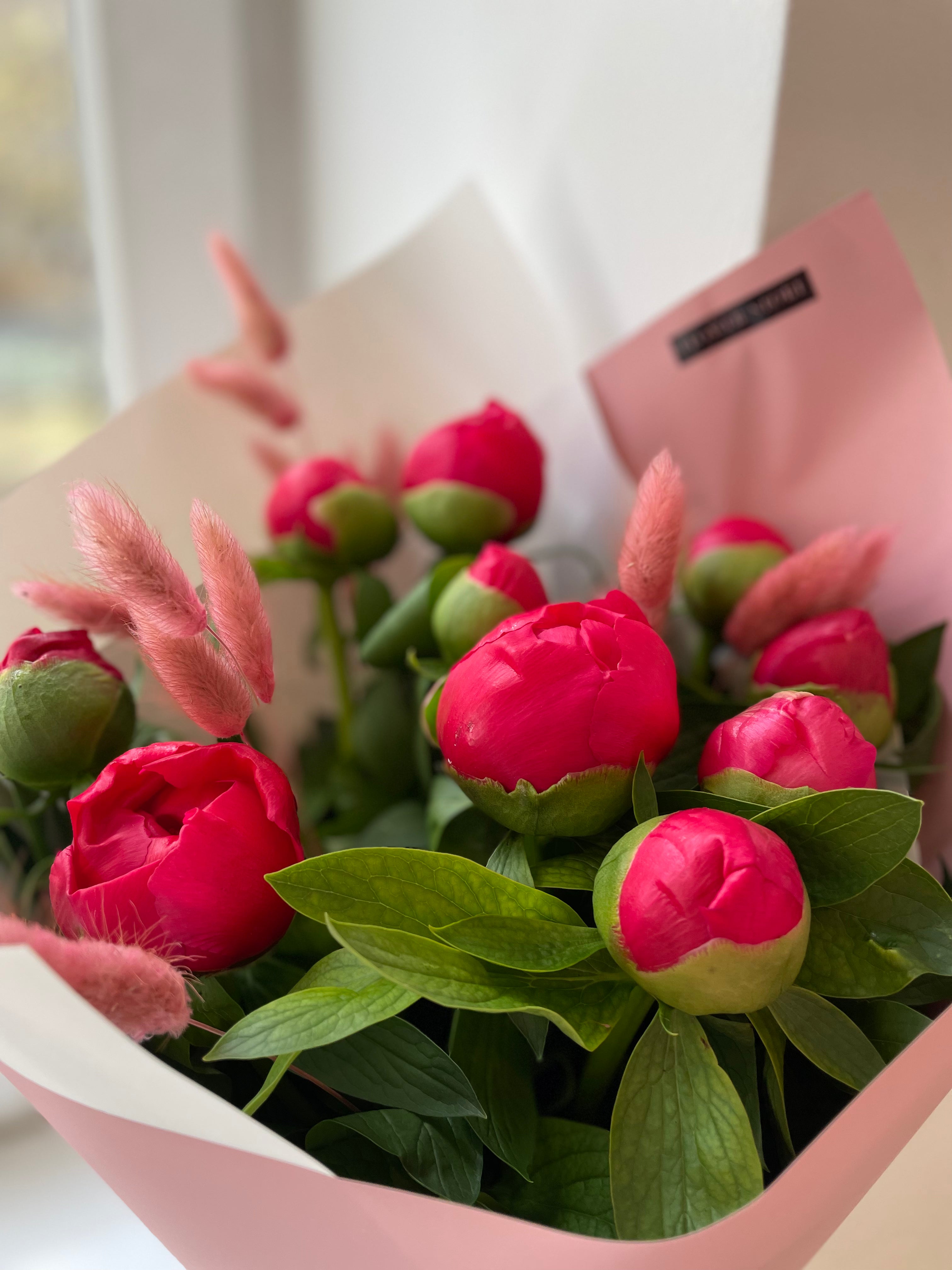 A bouquet of peonies in a vase