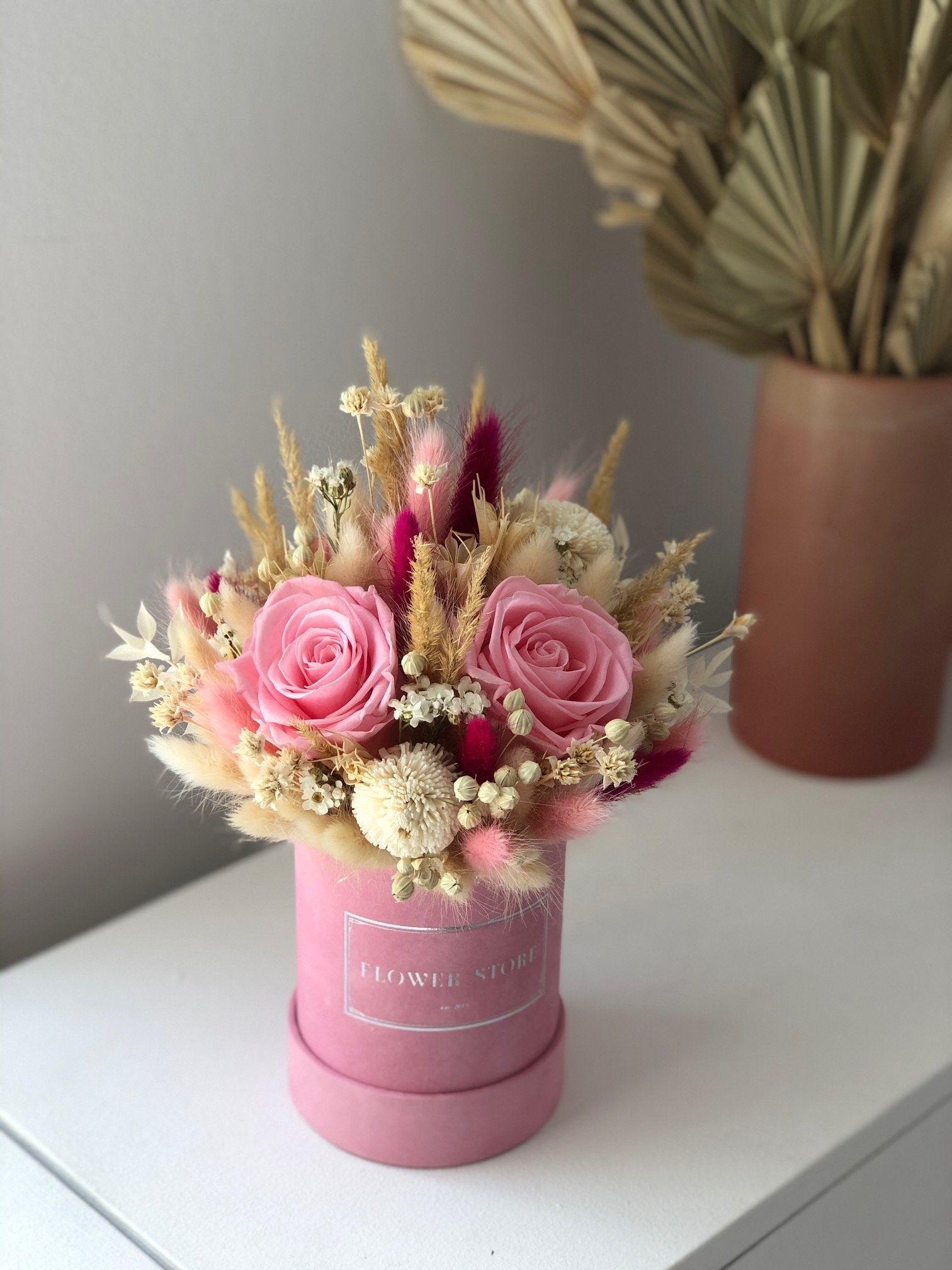 Small dried flowerbox with 3 pink eternal roses