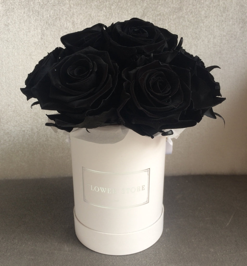 Eternal black roses in a white box