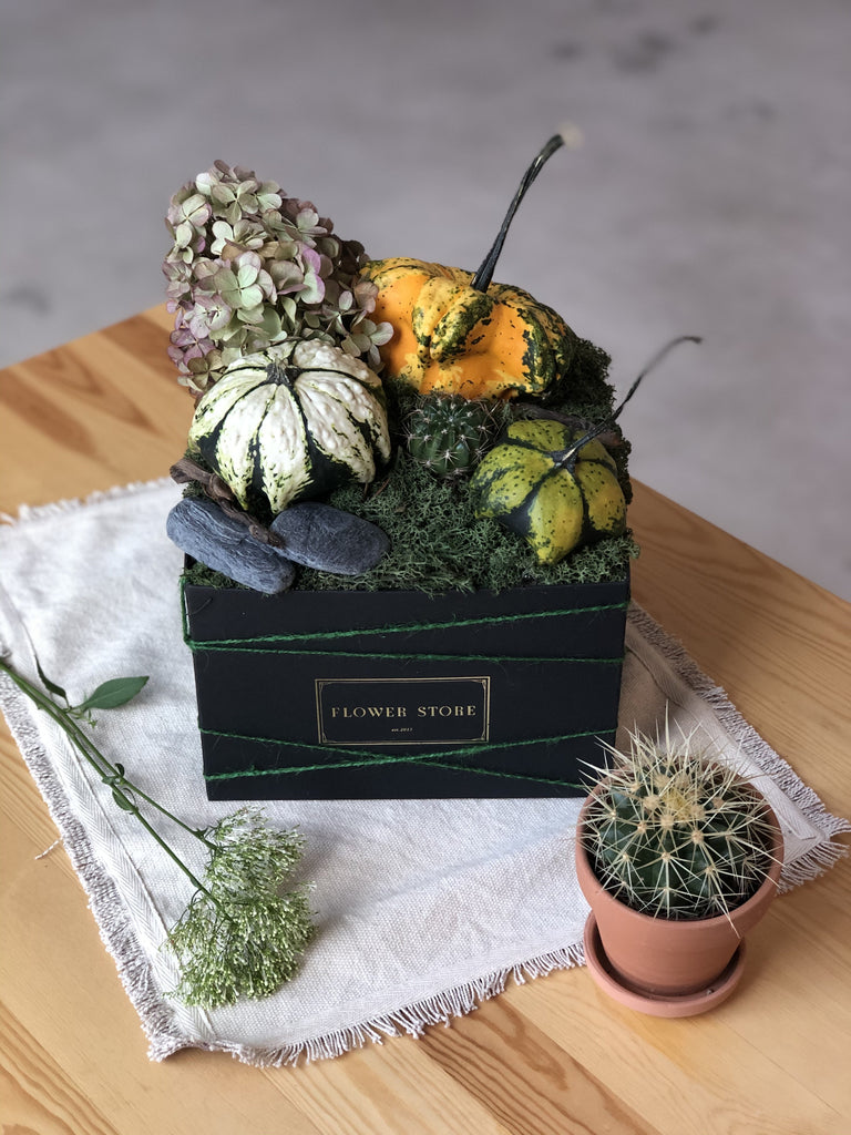 Autumn square box with natural pumpkins