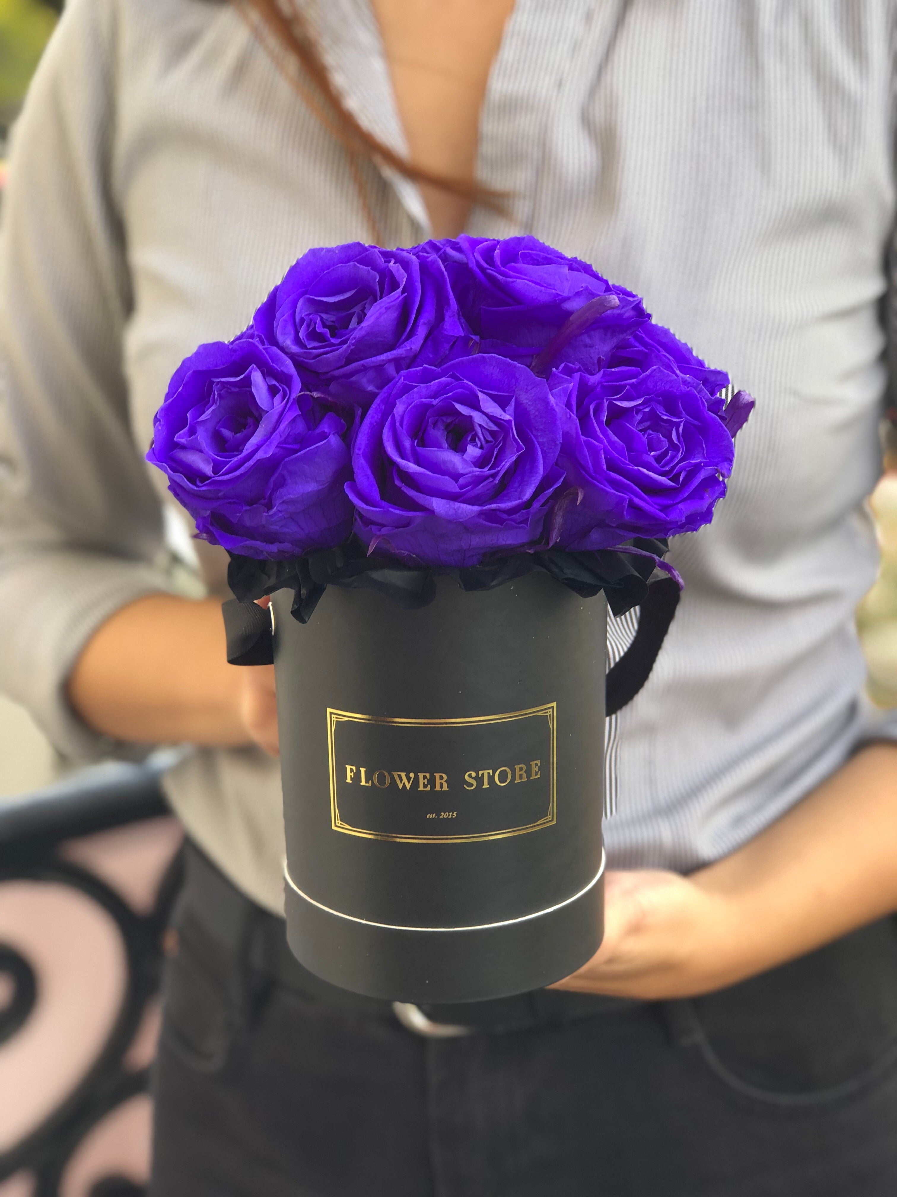 A small black box with navy blue eternal roses