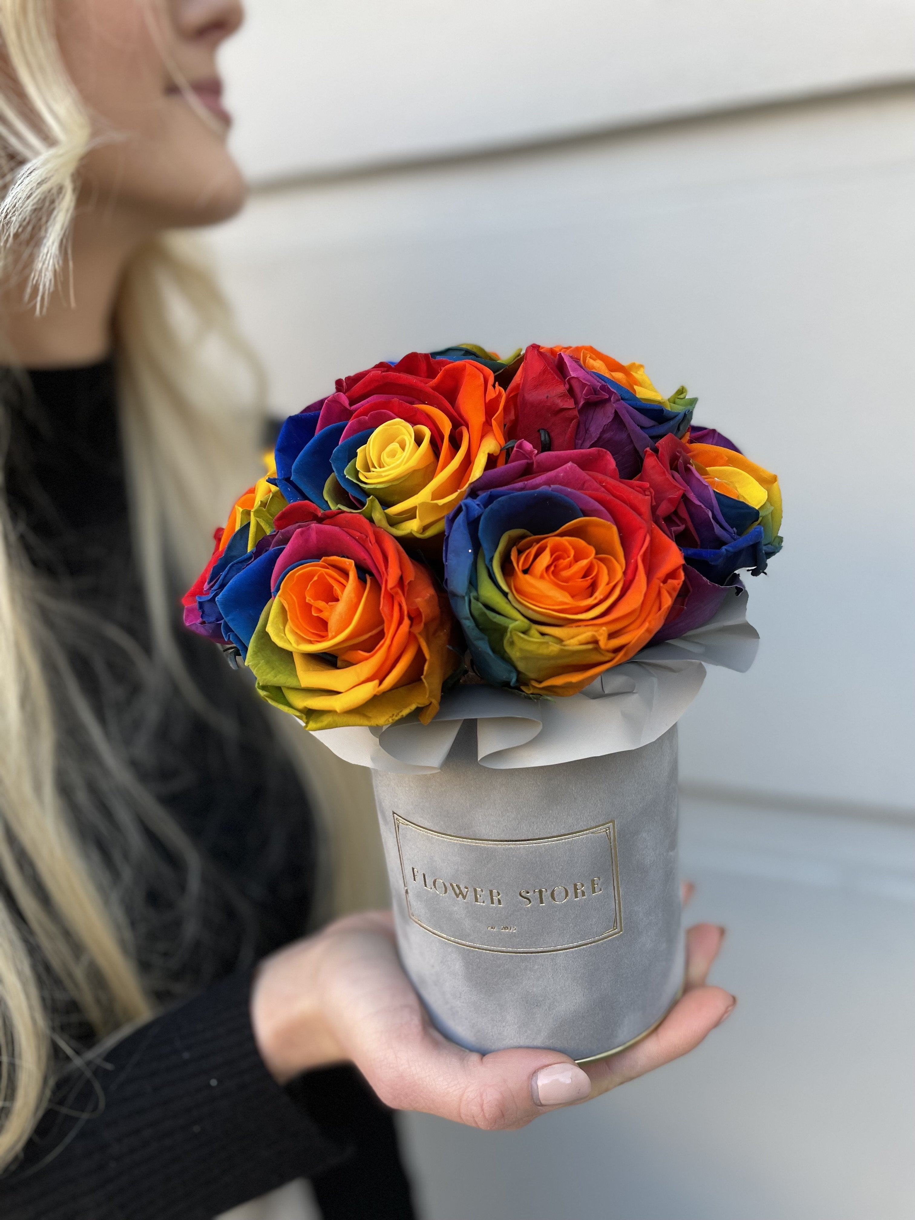 Rainbow eternal roses in a gray box