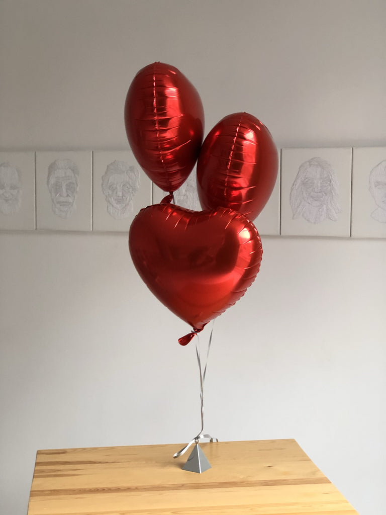 3 red helium heart balloons