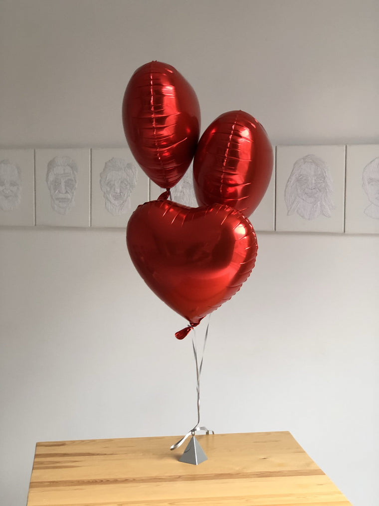 3 red helium heart balloons